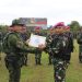 PANGKOOPS TNI HABEMA LAKSANAKAN UPACARA PELEPASAN SATGAS PAMTAS MOBILE RI-PNG YONIF 7 MARINIR