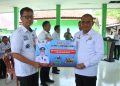 Penjabat Bupati Lampura Hadiri Sosialisasi Penanganan Sampah dan Serahkan Bantuan Bentor dan Mesin Pemotong Rumput